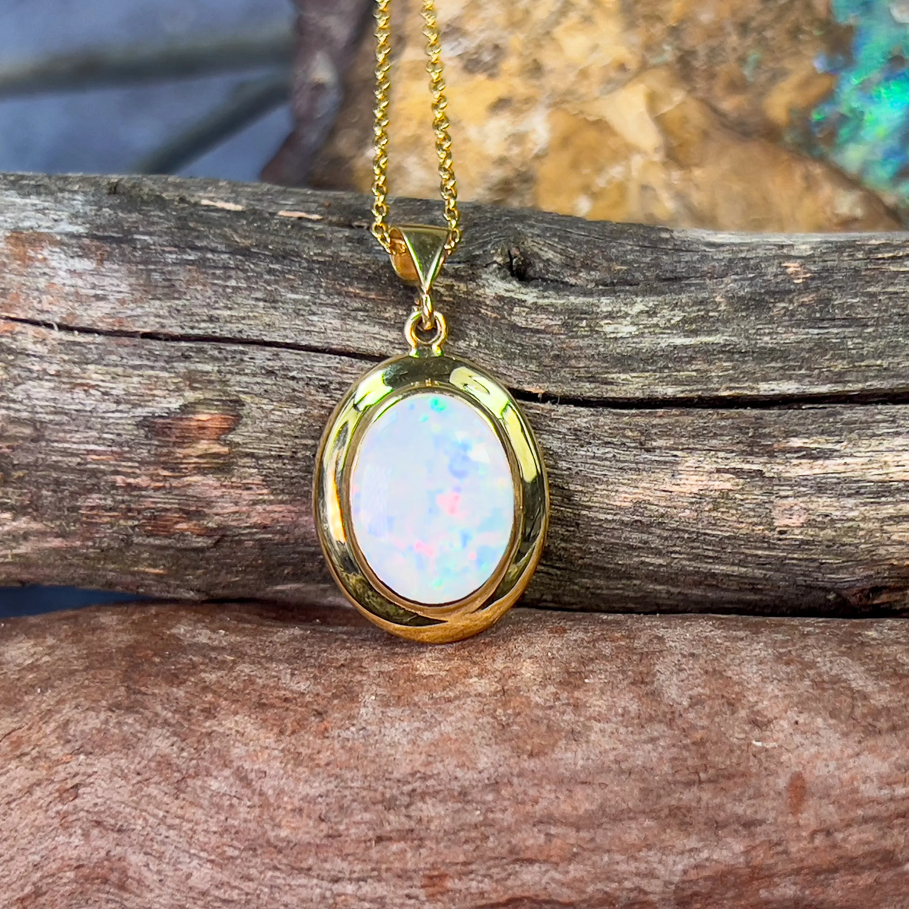 18kt Yellow Gold bezel set oval white opal 2.2ct pendant