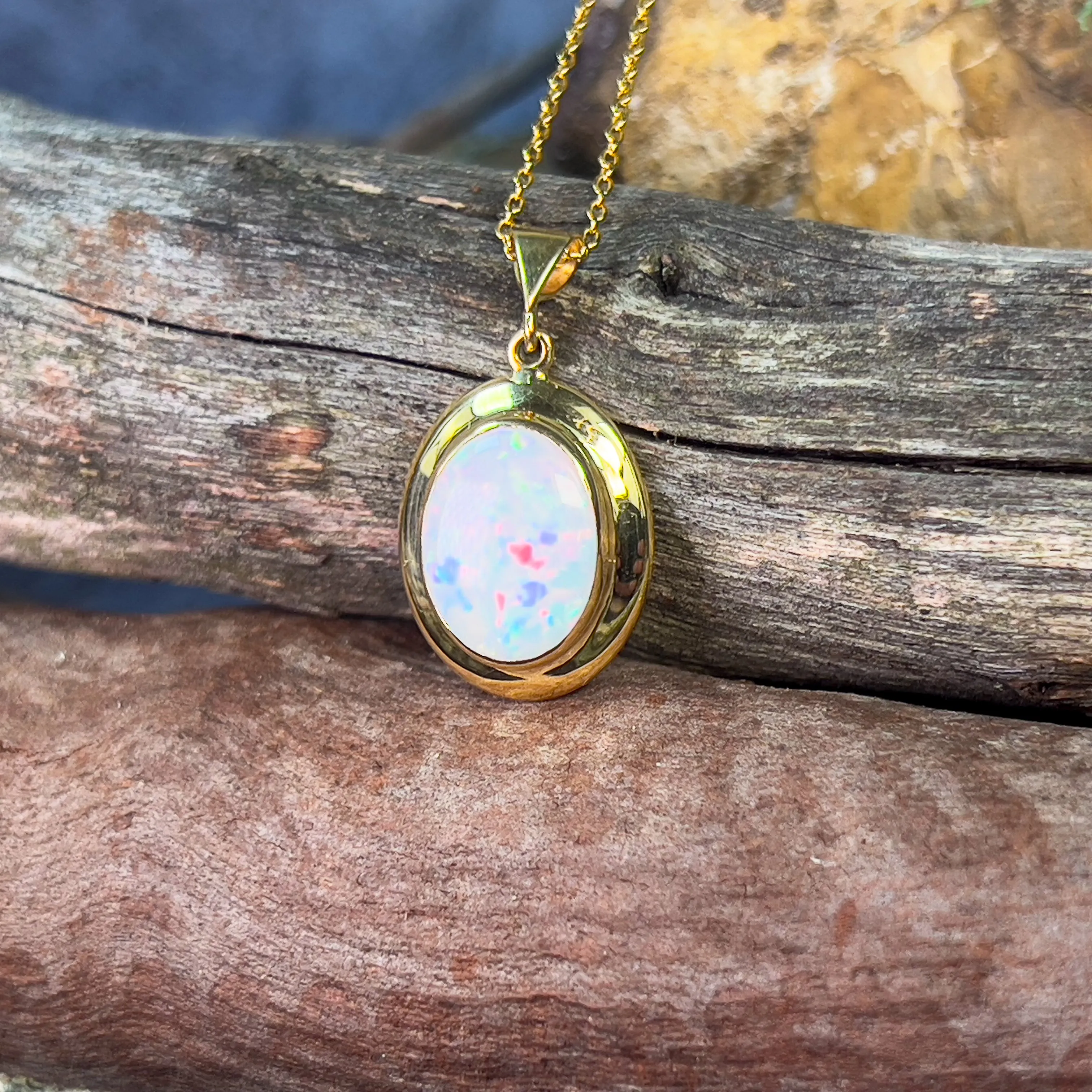 18kt Yellow Gold bezel set oval white opal 2.2ct pendant