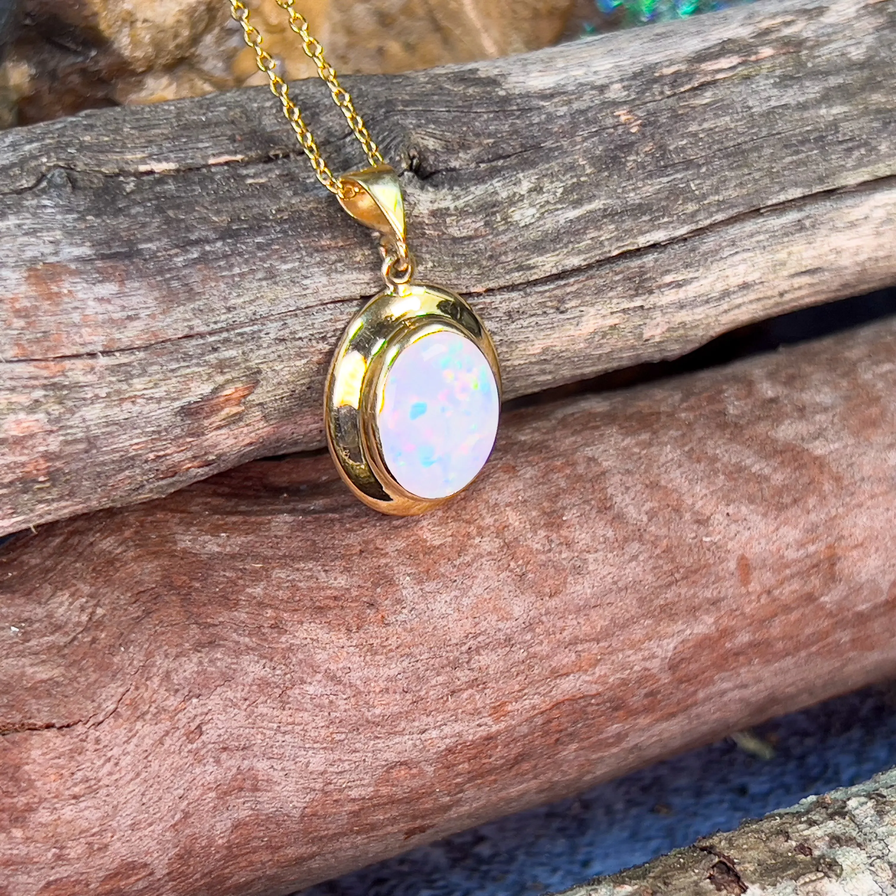 18kt Yellow Gold bezel set oval white opal 2.2ct pendant