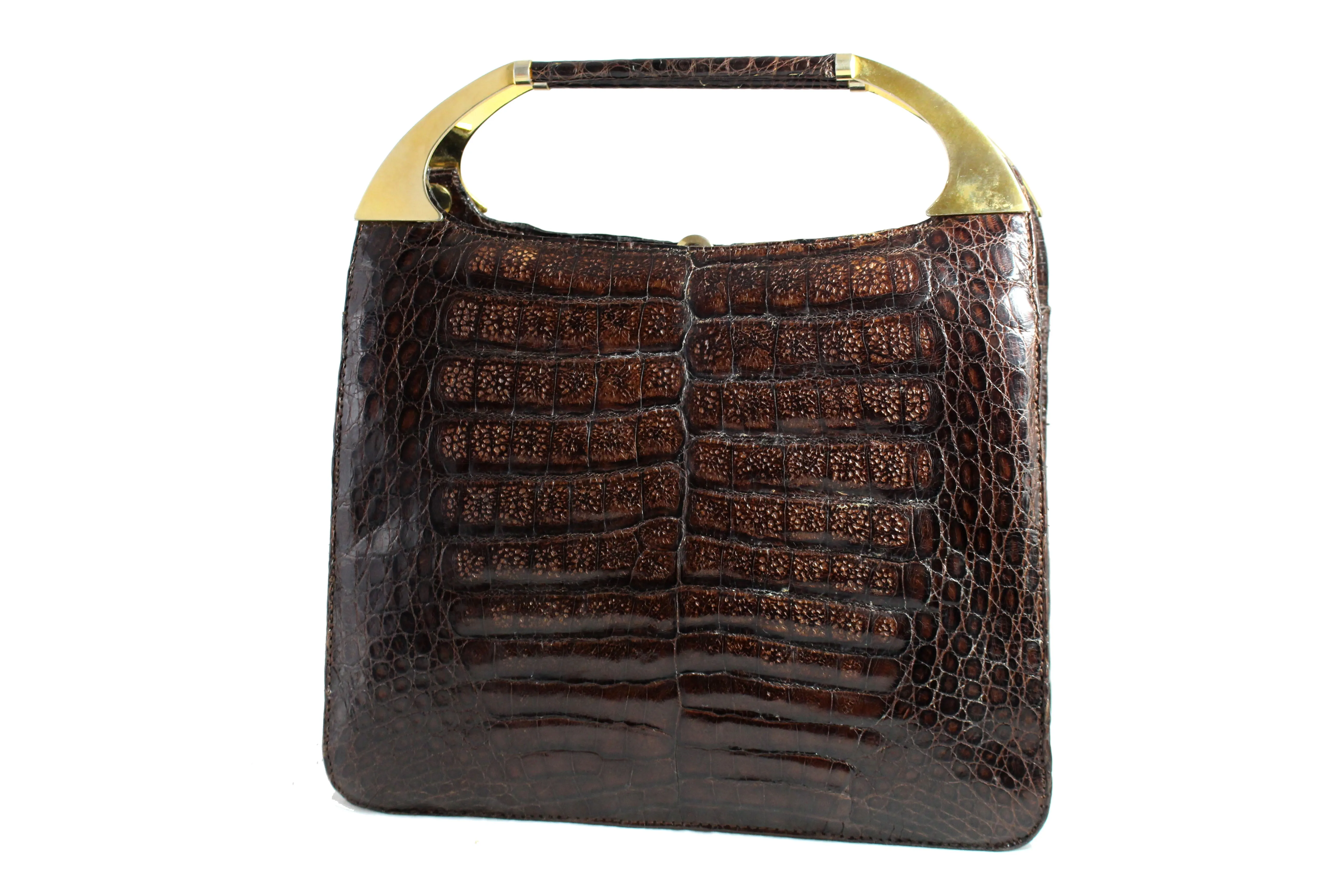 Brown crocodile skin handbag with decorative handles