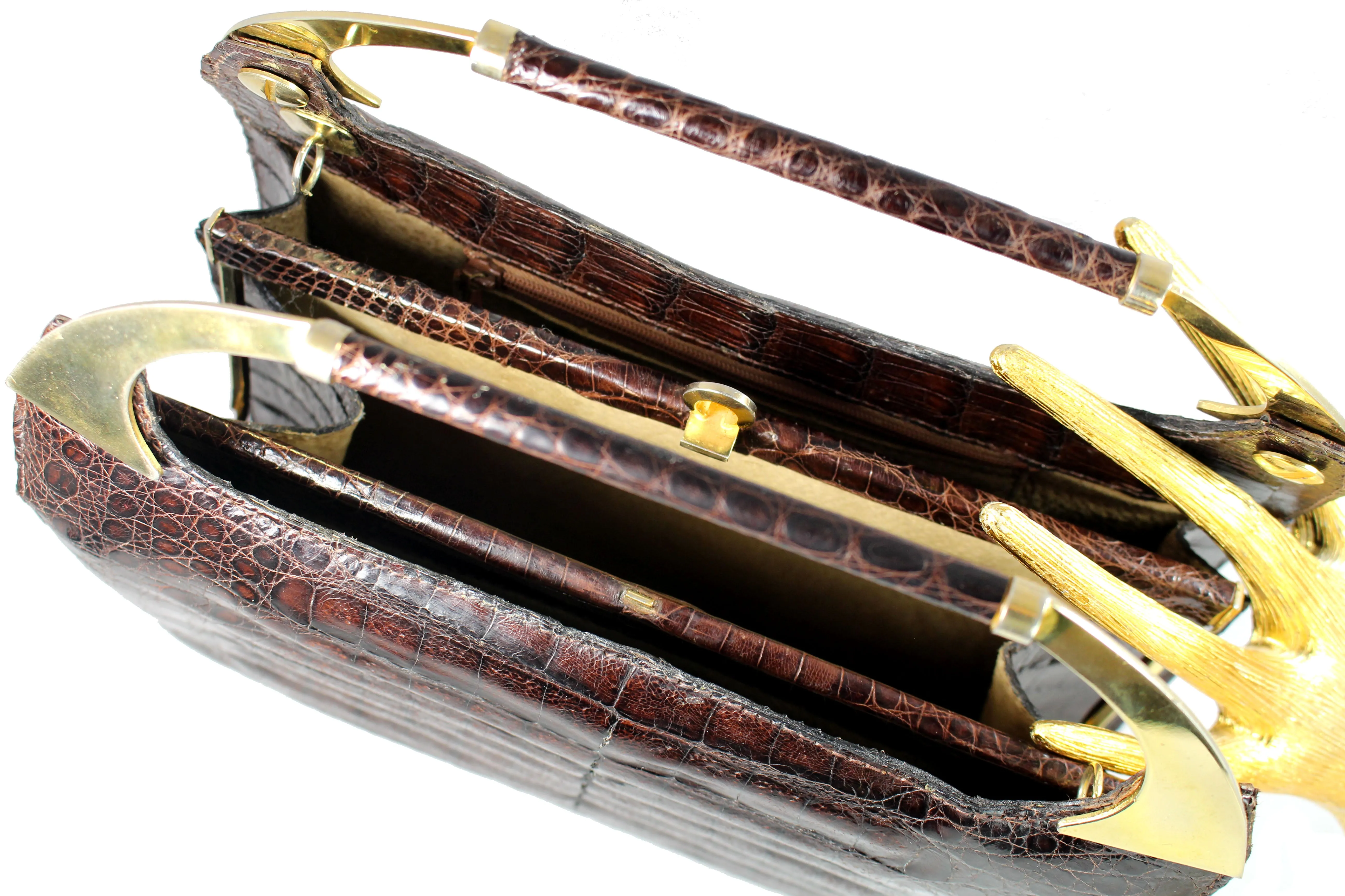 Brown crocodile skin handbag with decorative handles